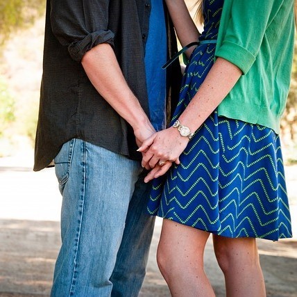 A man and woman holding hands. A man and woman holding hands.