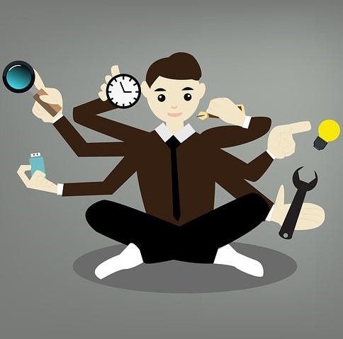 Illustration of a man with six arms doing six tasks simultaneously. Illustration of a man with six arms doing six tasks simultaneously.