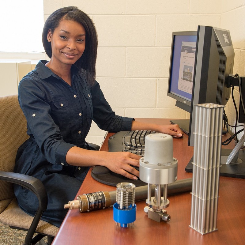 J’Tia Taylor sits at her desk. She is a nonproliferation technical specialist at an engineering research laboratory. J’Tia Taylor sits at her desk. She is a nonproliferation technical specialist at an engineering research laboratory.