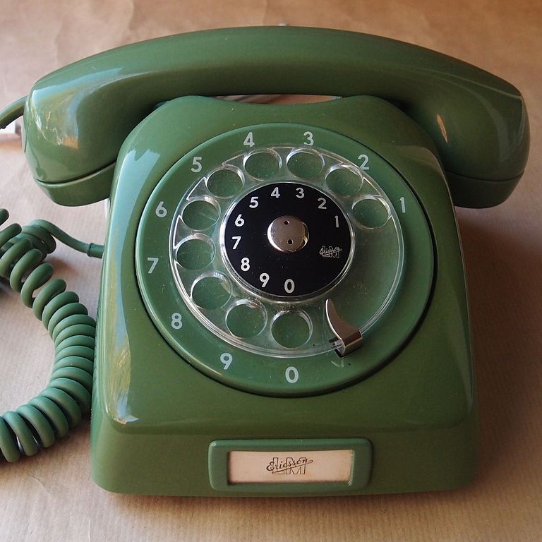 A rotary dial telephone. A rotary dial telephone.