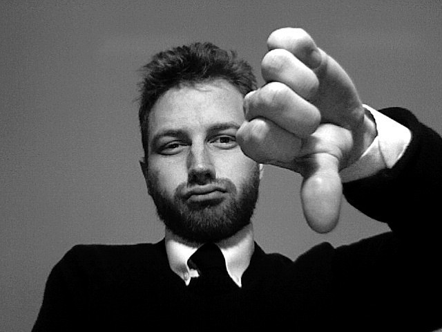 A man giving the thumbs-down sign of disapproval. A man giving the thumbs-down sign of disapproval.