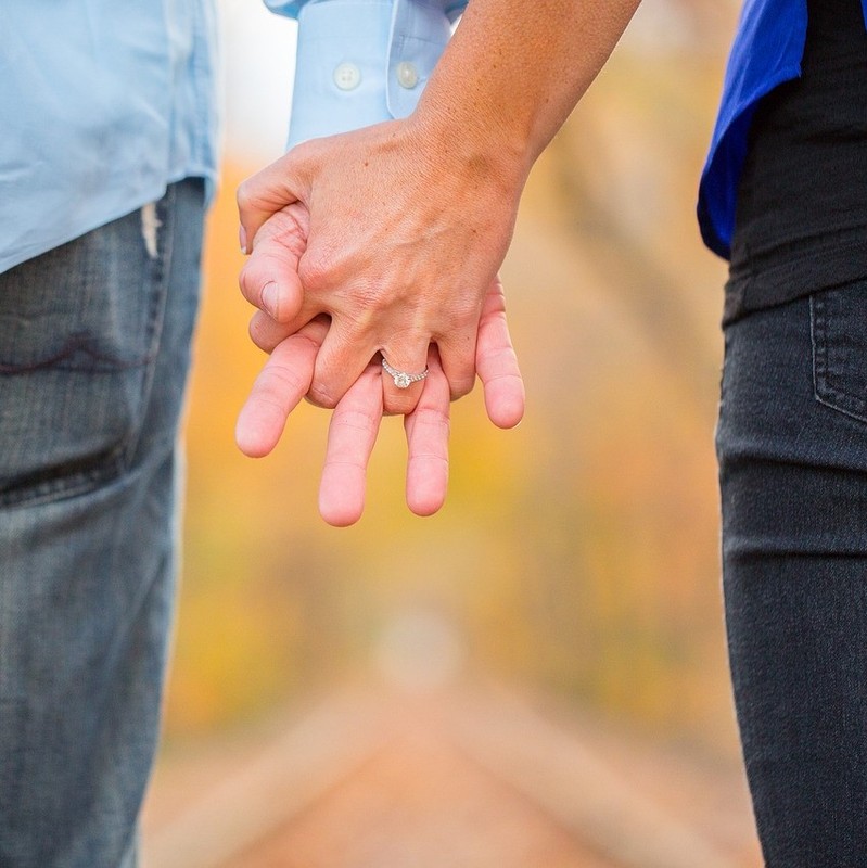 A couple holding hands. A couple holding hands.