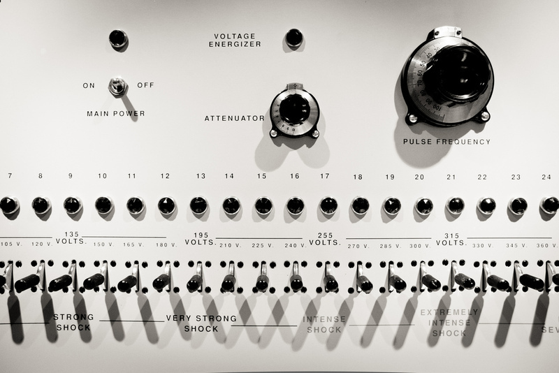 Close up of the controls of the shock machine used in the Milgram Experiment. The machine shows settings for "strong shock", "very strong shock", "intense shock", "extremely intense shock", and "severe shock". Close up of the controls of the shock machine used in the Milgram Experiment. The machine shows settings for "strong shock", "very strong shock", "intense shock", "extremely intense shock", and "severe shock".