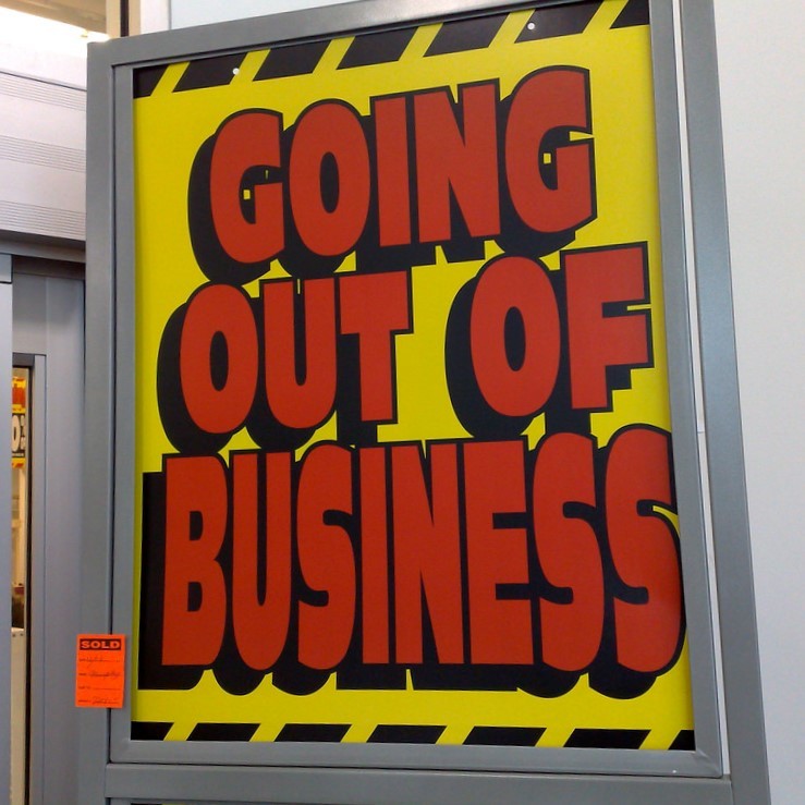 A "Going out of Business" sign is posted outside a store. A "Going out of Business" sign is posted outside a store.