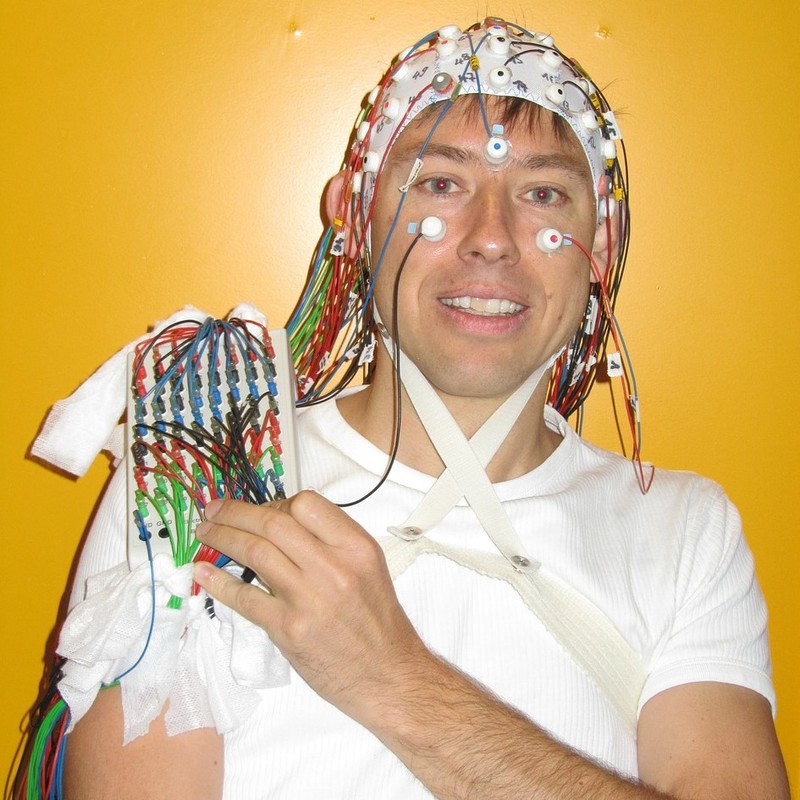 Man wearing an EEG cap. Man wearing an EEG cap.