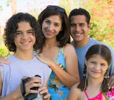 A traditional family including a mother, father, son and daughter. A traditional family including a mother, father, son and daughter.