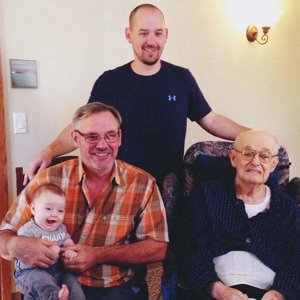 A family photo of four generations of men from great grandfather to great grandson. A family photo of four generations of men from great grandfather to great grandson.