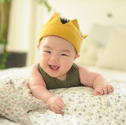 An adorable smiling infant. An adorable smiling infant.